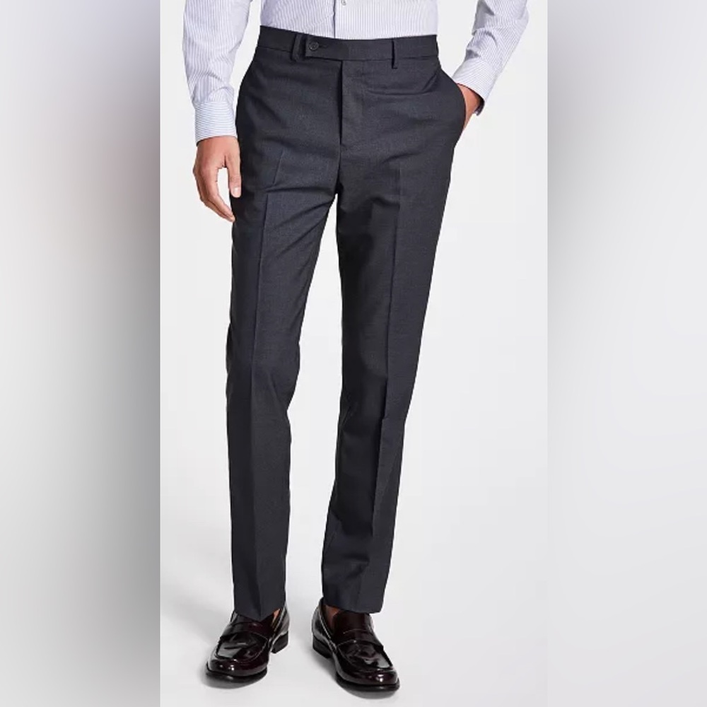 New w/ tags. Men’s Calvin Klein dress pants. Charcoal in color. 34W x 30L.